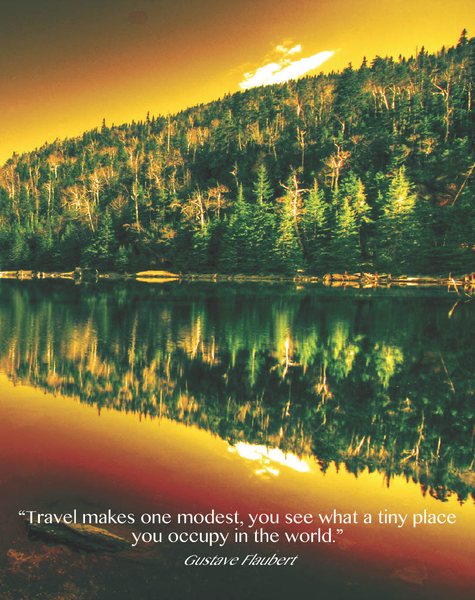 Magazine page with a mountain lake at sunset reflected in still water.