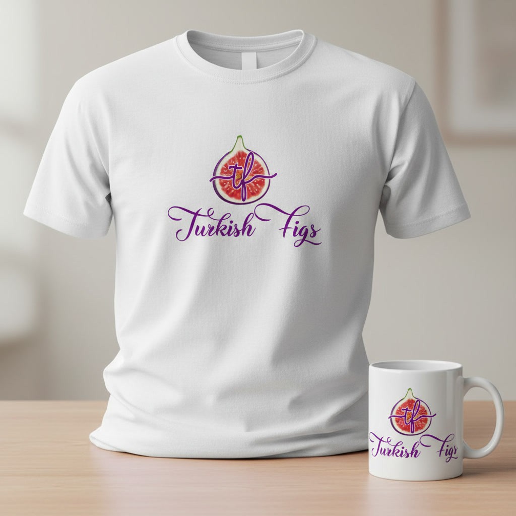 A white t-shirt printed with the Turkish Figs logo, a fig with the letters t and f above purple script, with a matching mug on a wooden table.
